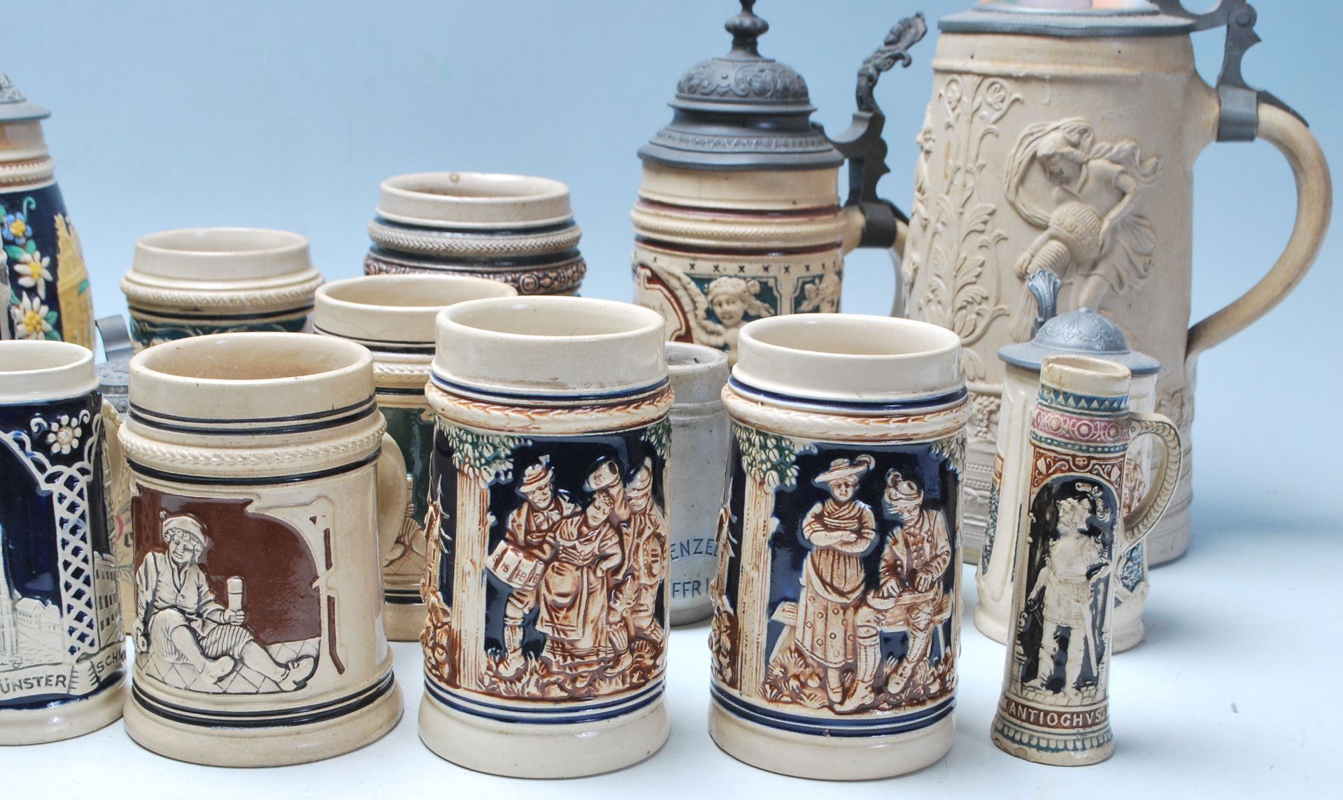 A large collection of German blue and grey stoneware jugs and beer steins, some having pewter - Image 5 of 11