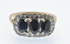 A Hallmarked Sapphire & Diamond Triple Cluster Ring