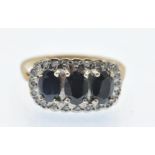 A Hallmarked Sapphire & Diamond Triple Cluster Ring