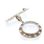 An Antique Pearl & Garnet Brooch Locket