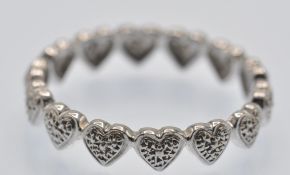 A hallmarked 9ct White Gold & Diamond Heart Band Ring
