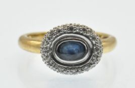 A hallmarked 18ct gold Sapphire and diamond cluster ring. The ring set with a central oval mixed cut