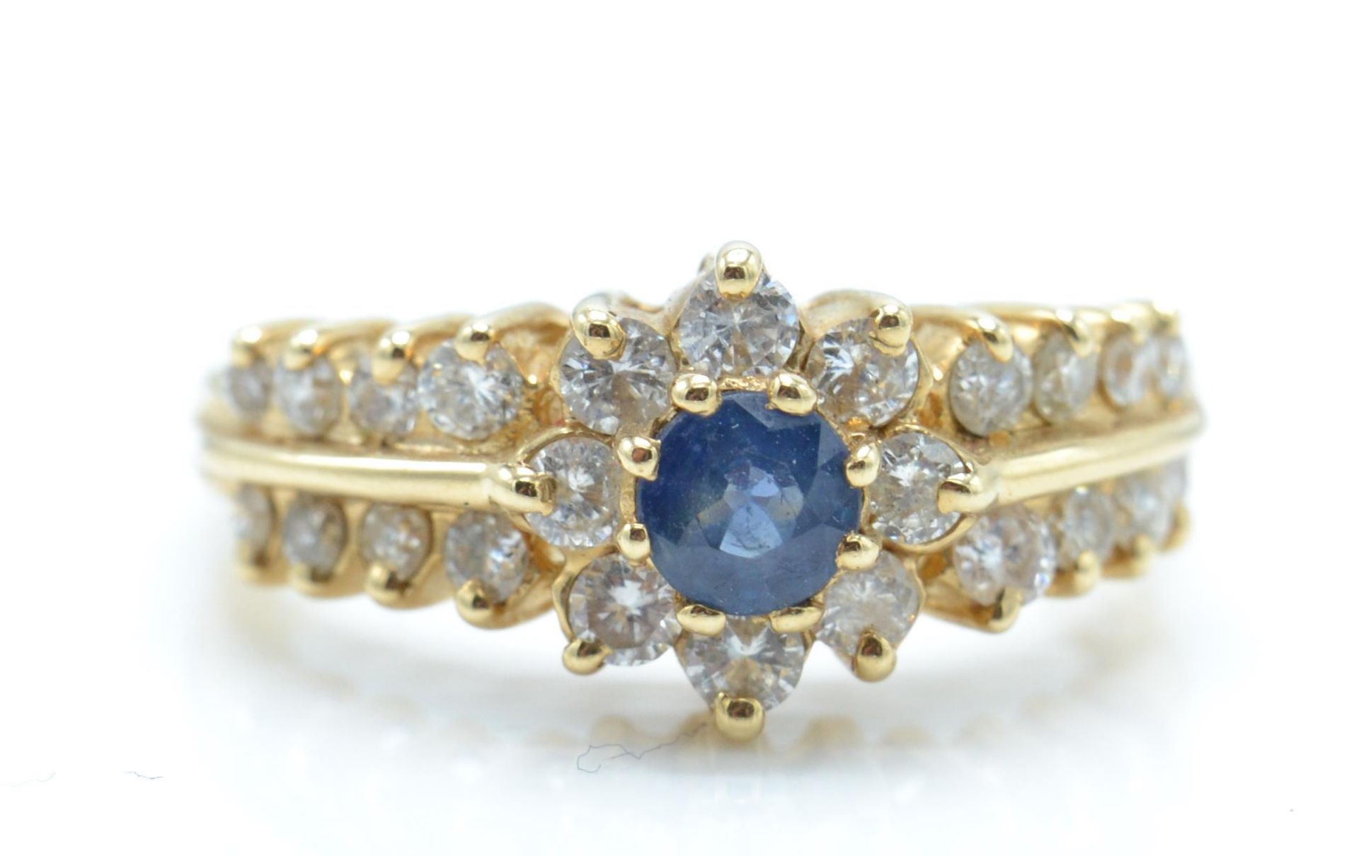 A 14ct gold sapphire and diamond ring. The ring be