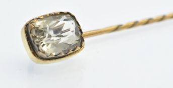 An Antique Gold & Topaz Stick Pin