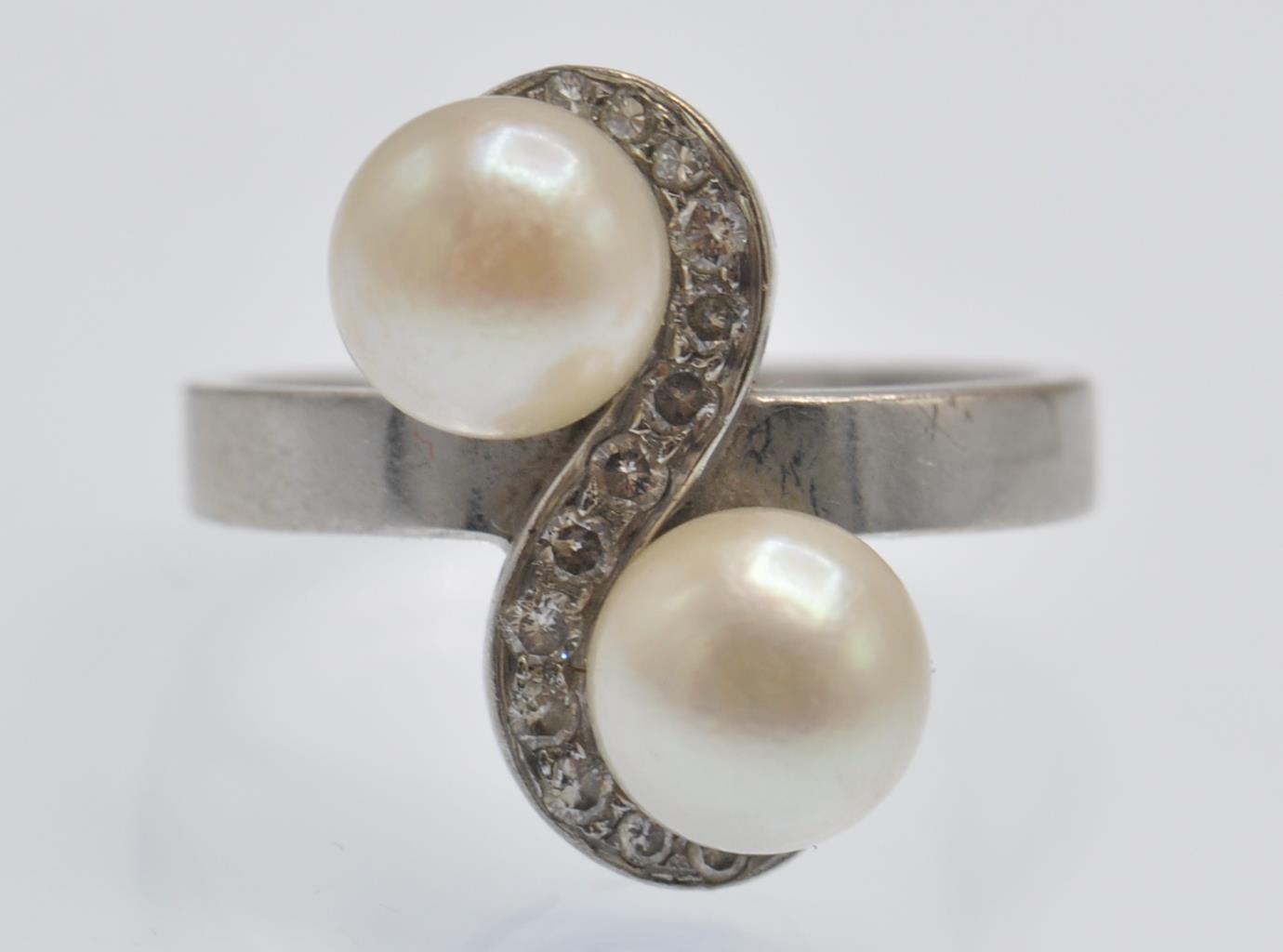 An Antique White Gold Pearl & Diamond Crossover Ring