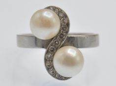 An Antique White Gold Pearl & Diamond Crossover Ring