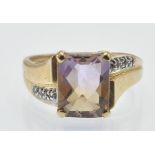 A hallmarked 9ct gold ametrine and diamond ring