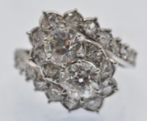 A French 18ct Gold Platinum Diamond Crossover Cluster Ring
