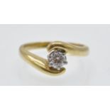 An 18ct Gold & Diamond Solitaire Crossover Ring