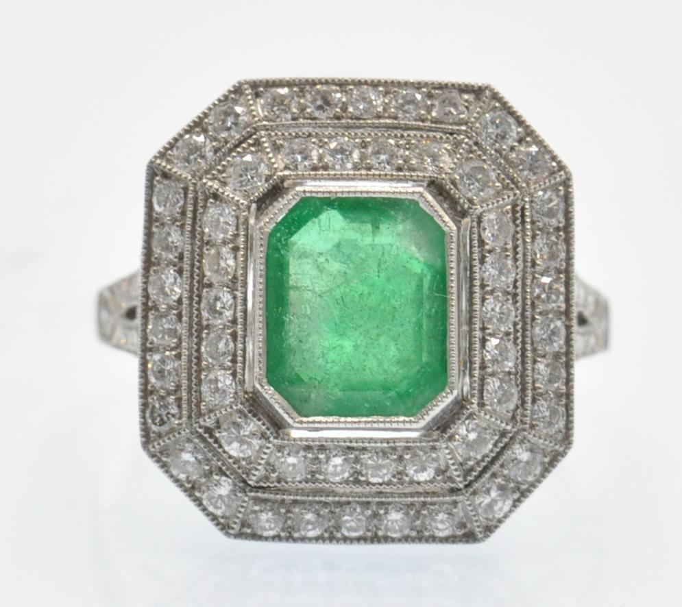 A Platinum Emerald & Diamond Cocktail Ring.