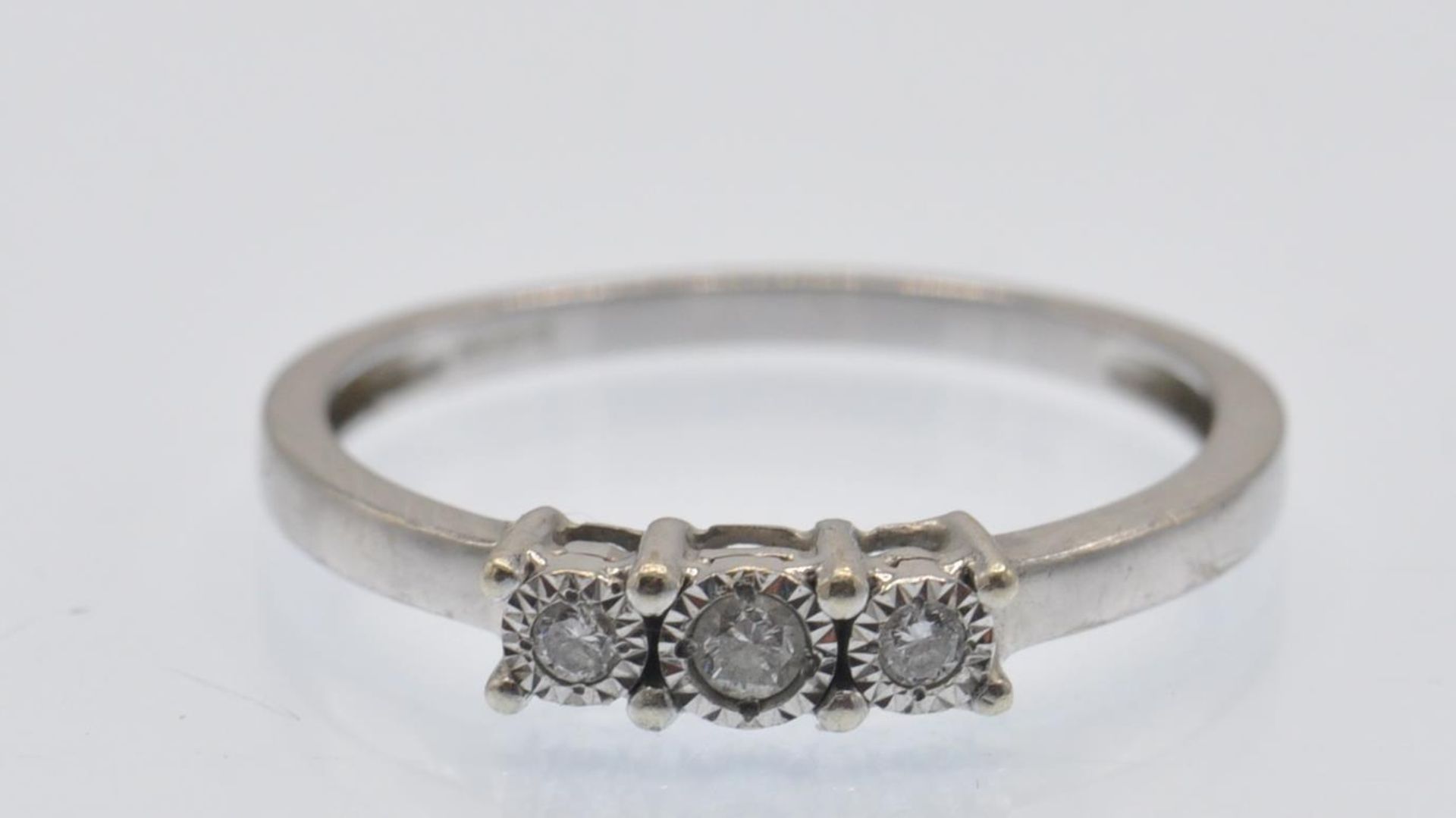 A Hallmarked 9ct White Gold Three Stone Diamond Ring