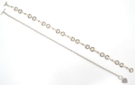 A large silver booklink necklace chain with hoop a