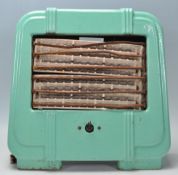 A 1930's Art Deco green enamel heater made in Engl