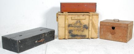 A group of four wooden storage boxes to include a