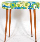 A retro vintage kidney shaped stool upholstered in