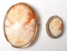 Two vintage 20th Century cameo brooches having car