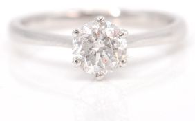 An 18 ct white gold single stone diamond ring. The