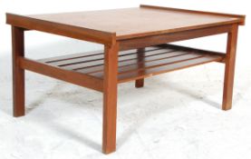 A retro mid 20th Century teak wood coffee table of