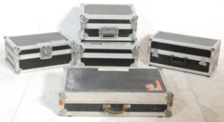 A group of five music equipment flight cases with