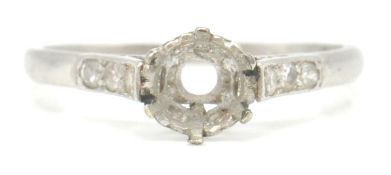 A 1930's platinum ring mount having diamond set sh