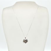 A 9ct white gold heart pendant locket and back cha