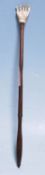 A 19th Century Victorian back scratcher having a c