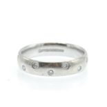 An 18ct White Gold & Diamond Band Ring