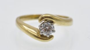 An 18ct Gold & Diamond Solitaire Crossover Ring