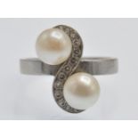 An Antique White Gold Pearl & Diamond Crossover Ring