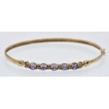 A Hallmarked 9ct Gold & Gem Set Bangle