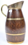 A 19TH CENTURY GEORGIAN OAK AND BRASS CIDER PITCHER EWER