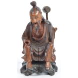 19TH CENTURY CHINESE CARVED FIGURINE OF A SEATED ELDER