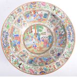 A LARGE 19TH CENTURY CHINESE CANTON FAMILLE ROSE CENTERPIECE BOWL