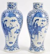 A PAIR OF 18TH CENTURY CHINESE KANGXI BLUE AND WHITE VASES OF LOBED FORM