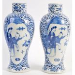 A PAIR OF 18TH CENTURY CHINESE KANGXI BLUE AND WHITE VASES OF LOBED FORM