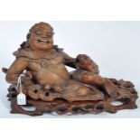 LARGE 19TH CENTURY CHINESE CARVED RECLINED LIU HAI FIGURE