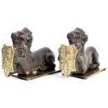 PAIR OF 19TH CENTURY CAST IRON FIRESIDE DOGS IN THE FROM OF LIONS