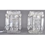 A MATCHING PAIR OF VICTORIAN ANTIQUE CUT GLASS TABLE LUSTRES