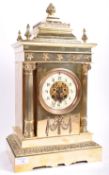 A 19TH CENTURY VICTORIAN POLISHED BRASS CASED TABLE CLOCK HOUSING A BRASS MOVEMENT