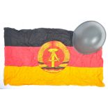 EAST GERMAN GUARD'S HELMET & ORIGINAL FLAG