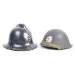 PAIR OF LONDON FIRE BRIGADE HELMETS - WITH BADGES