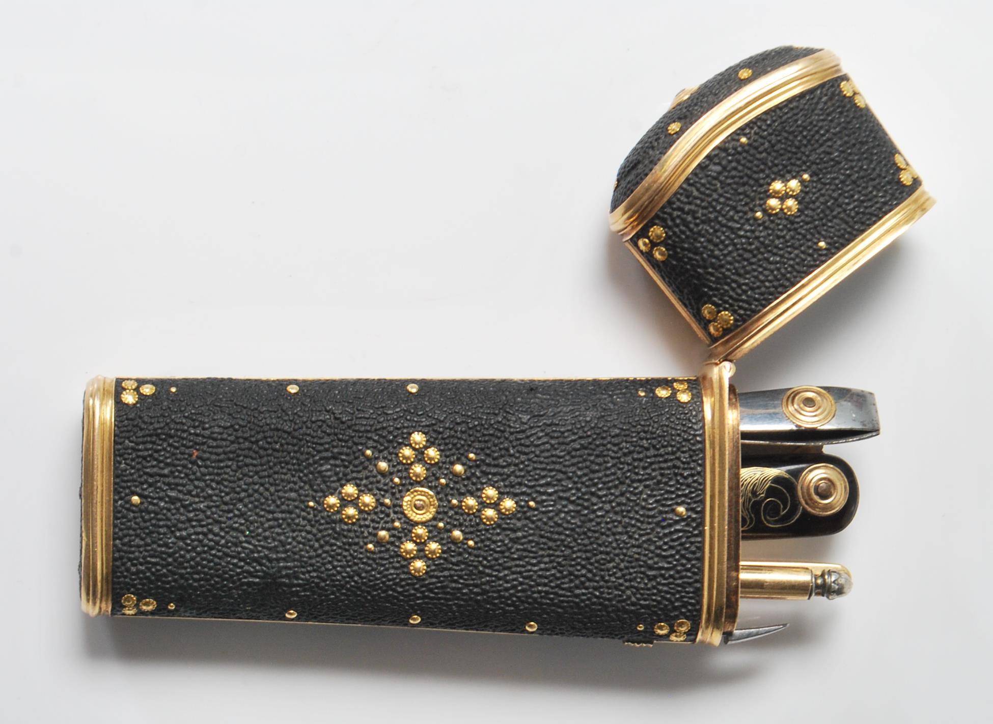 An Etui vanity case having a gilt borders and piqu