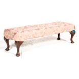 A 19th century George III long oak footstool ottom