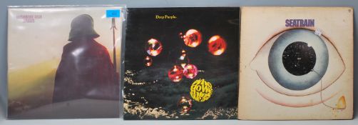 A mixed group of three rock vinyl long play LP rec