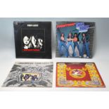 A group of four vinyl long play record albums by T