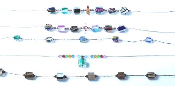 A group of five silver and glass bead necklaces ea