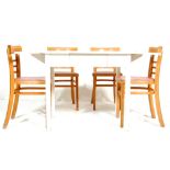 A vintage 20th Century shabby chic extending dinin