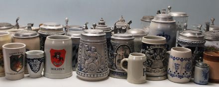 A collection of 20th Century German ceramic stein drinking glasses, each having raised decoration to