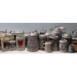 A collection of 20th Century German ceramic stein drinking glasses, each having raised decoration to