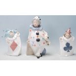 Three vintage 20th Century Valencian ceramic porcelain figurines comprising of a large clown holding